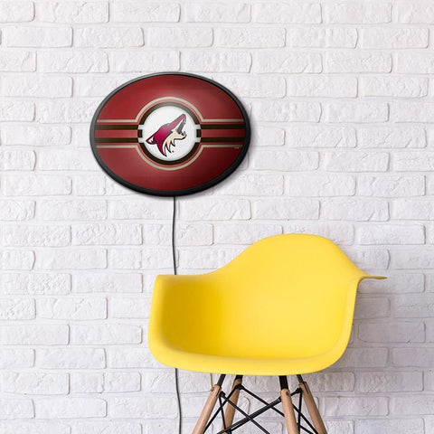 Arizona Coyotes: Oval Slimline Lighted Wall Sign - The Fan-Brand