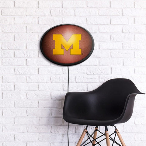 Michigan Wolverines: Pigskin - Oval Slimline Lighted Wall Sign - The Fan-Brand