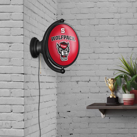 NC State Wolfpack: Tuffy's Face - Original Oval Rotating Lighted Wall Sign - The Fan-Brand