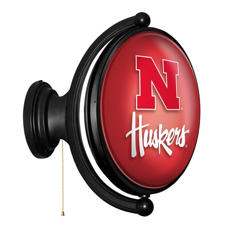 Nebraska Cornhuskers: Original Oval Rotating Lighted Wall Sign - The Fan-Brand