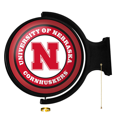 Nebraska Cornhuskers: Original Round Rotating Lighted Wall Sign - The Fan-Brand