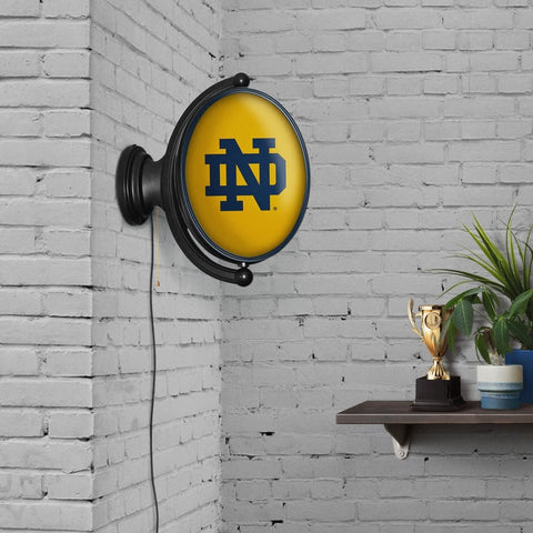 Notre Dame Fighting Irish: Original Oval Rotating Lighted Wall Sign - The Fan-Brand