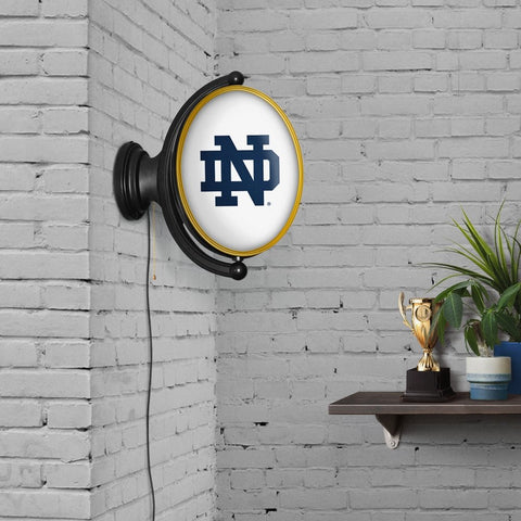 Notre Dame Fighting Irish: Original Oval Rotating Lighted Wall Sign - The Fan-Brand