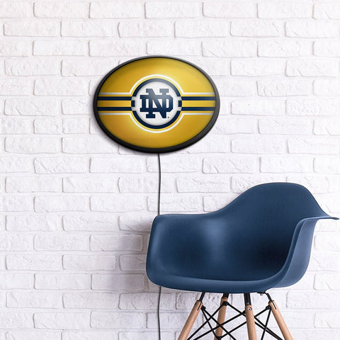 Notre Dame Fighting Irish: Oval Slimline Lighted Wall Sign - The Fan-Brand