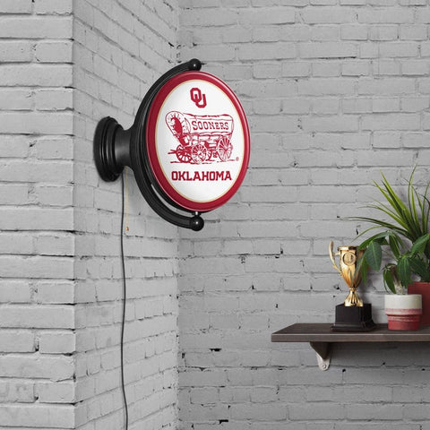 Oklahoma Sooners: Double Sided Original Oval Rotating Lighted Wall Sign - The Fan-Brand