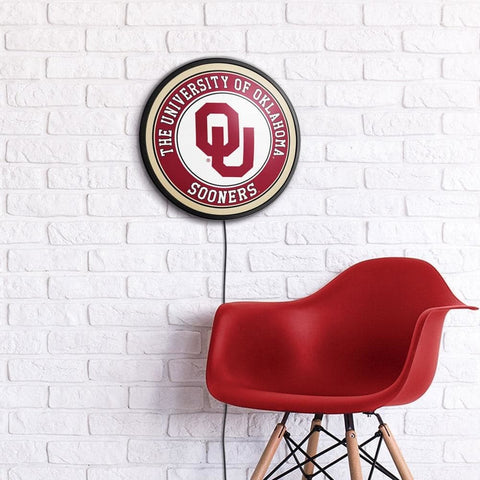 Oklahoma Sooners: Round Slimline Lighted Wall Sign - The Fan-Brand