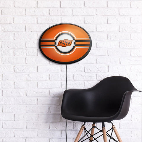 Oklahoma State Cowboys: Oval Slimline Lighted Wall Sign - The Fan-Brand