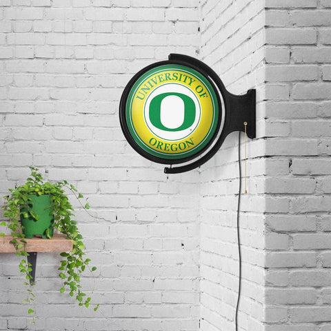 Oregon Ducks: Original Round Rotating Lighted Wall Sign - The Fan-Brand