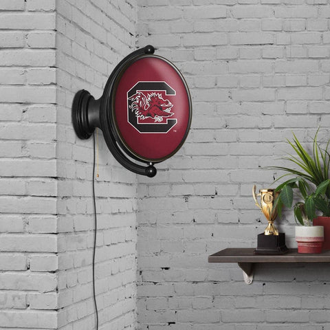 South Carolina Gamecocks: Original Oval Rotating Lighted Wall Sign - The Fan-Brand