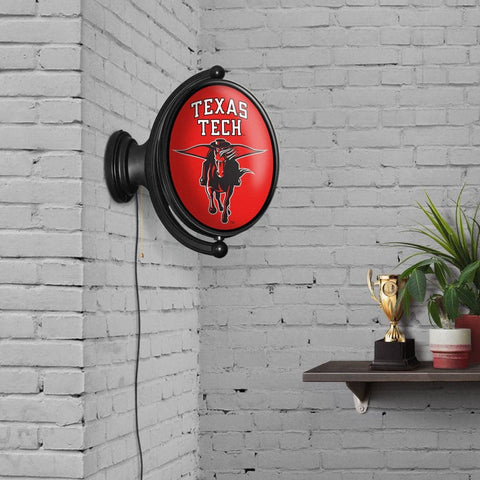 Texas Tech Red Raiders: Masked Rider - Original Oval Rotating Lighted Wall Sign - The Fan-Brand
