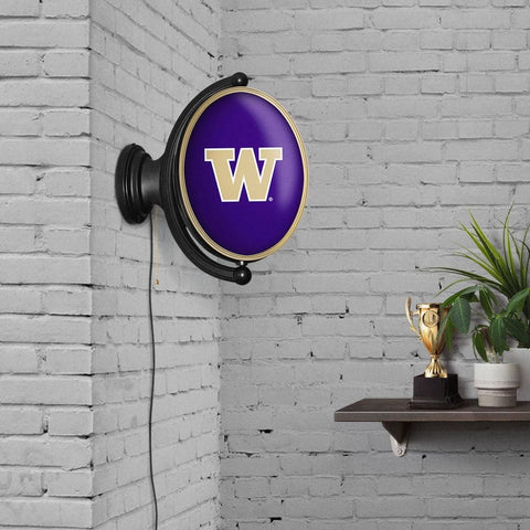 Washington Huskies: Original Oval Rotating Lighted Wall Sign - The Fan-Brand
