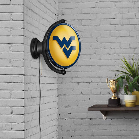 West Virginia Mountaineers: Original Oval Rotating Lighted Wall Sign - The Fan-Brand
