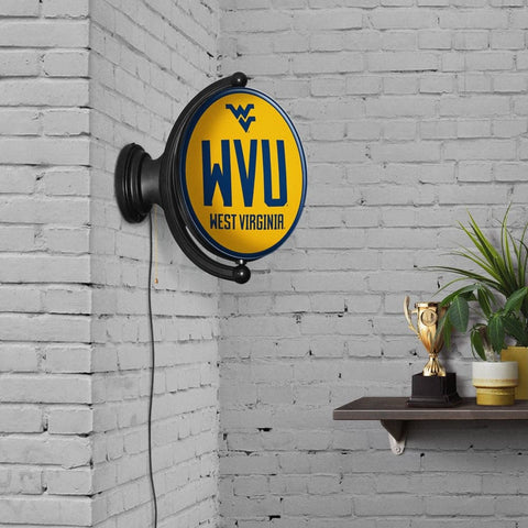 West Virginia Mountaineers: WVU - Original Oval Rotating Lighted Wall Sign - The Fan-Brand