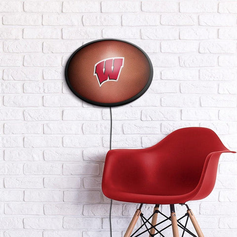 Wisconsin Badgers: Pigskin - Oval Slimline Lighted Wall Sign - The Fan-Brand